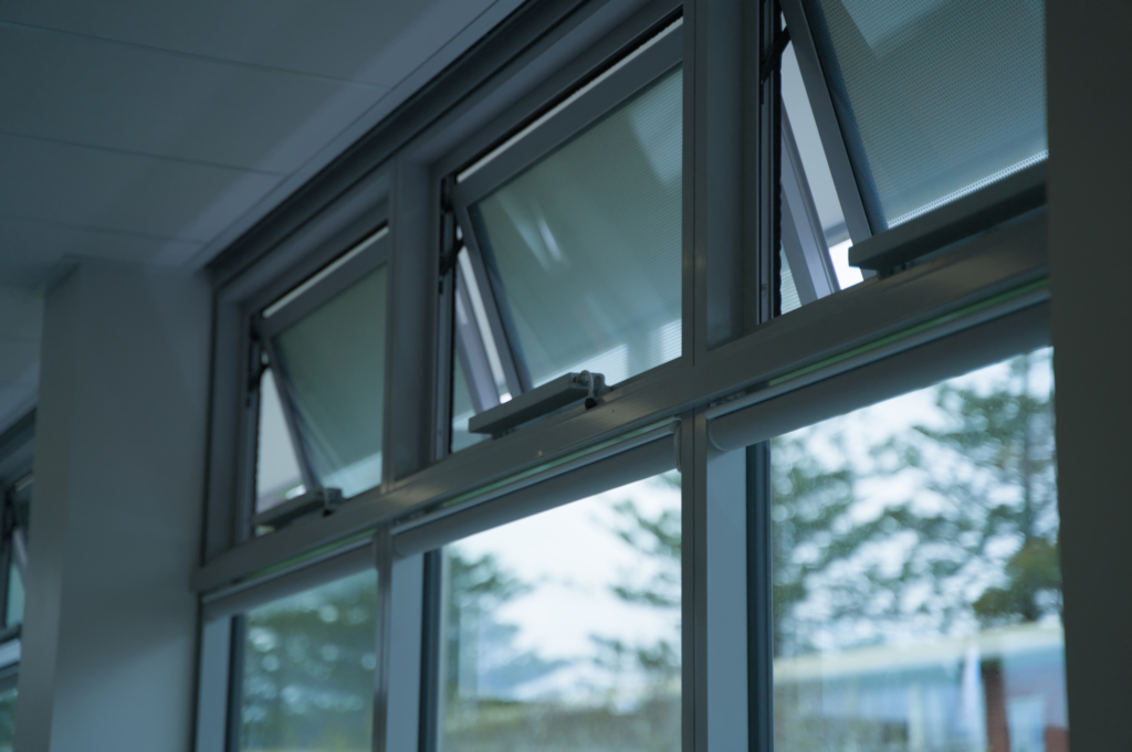 Liwin L35 electric chain drive installed on an awning window at Sacred Heart College