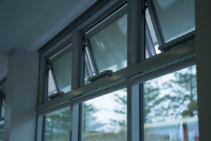 Liwin L35 electric chain drive installed on an awning window at Sacred Heart College